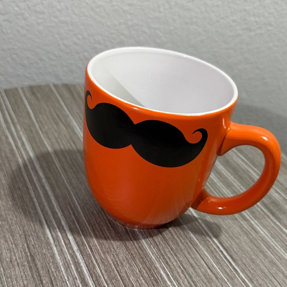 Orange Mug with Black Mustache Design